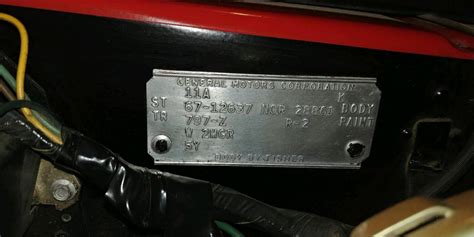 From 1965-67, this plate is on the left front body hinge pillar directly below the upper hinge. . 1970 nova cowl tag decoder
